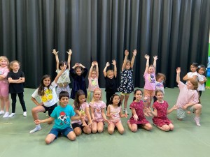 group of kids doing performing arts on a stage